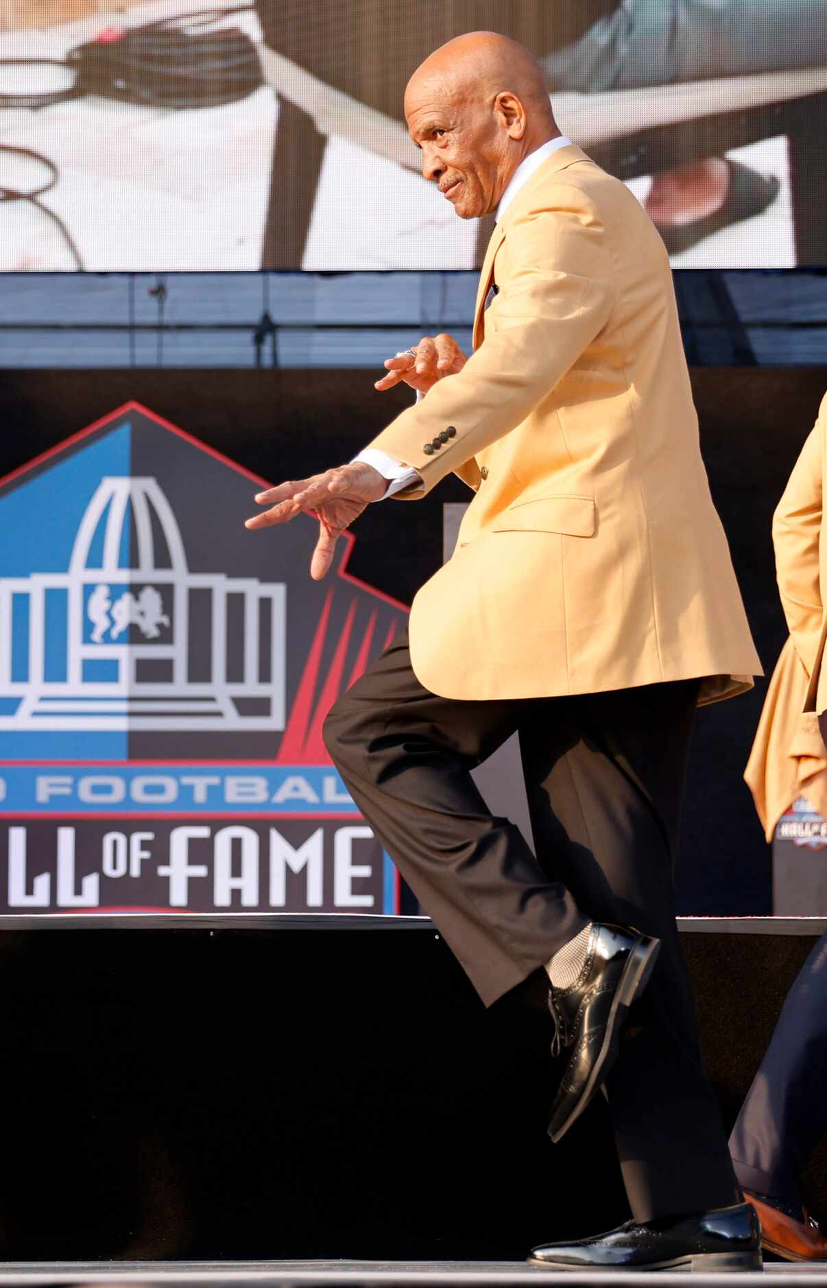 Pro Football Hall of Fame inductee Drew Pearson of the Dallas Cowboys strikes a pose onstage...