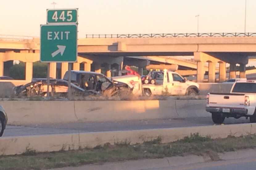 Police say the woman's car wrecked out on Interstate 35 before she was struck.