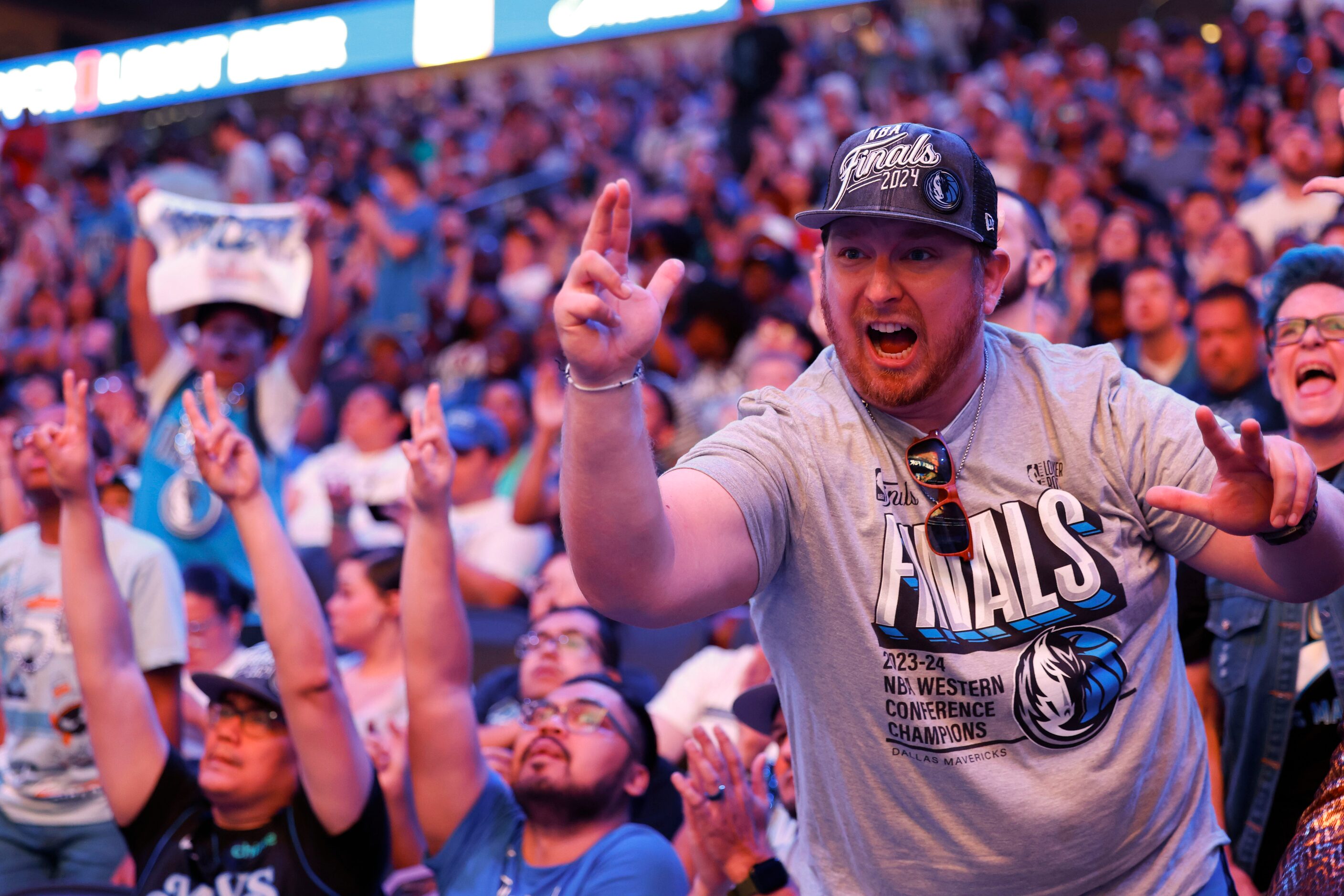 Jason Hicks (right) cheers following a point during a watch party of Game 1 of the NBA...