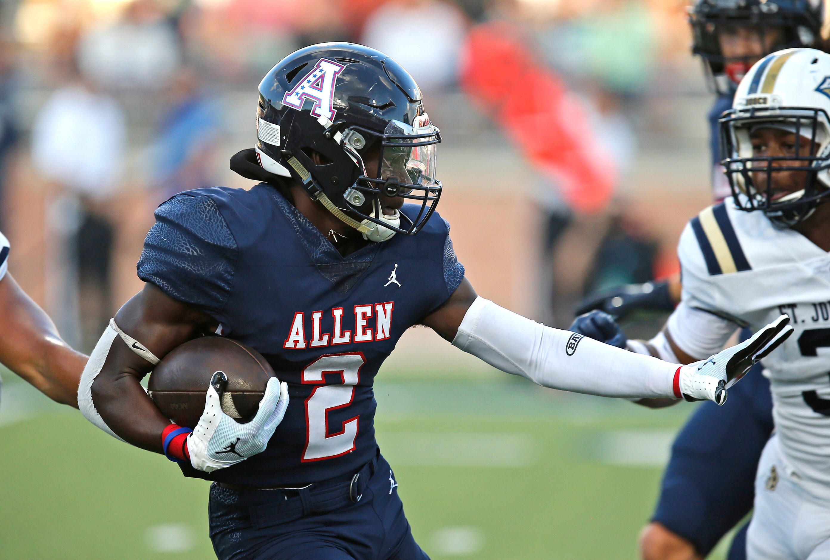 Allen High School running back Kayvion Sibley (2) carries the football during the first half...