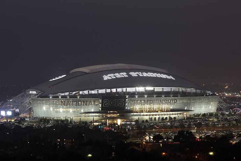  AT&T Stadium in Arlington glows against the night sky on Jan. 12 during the inaugural...