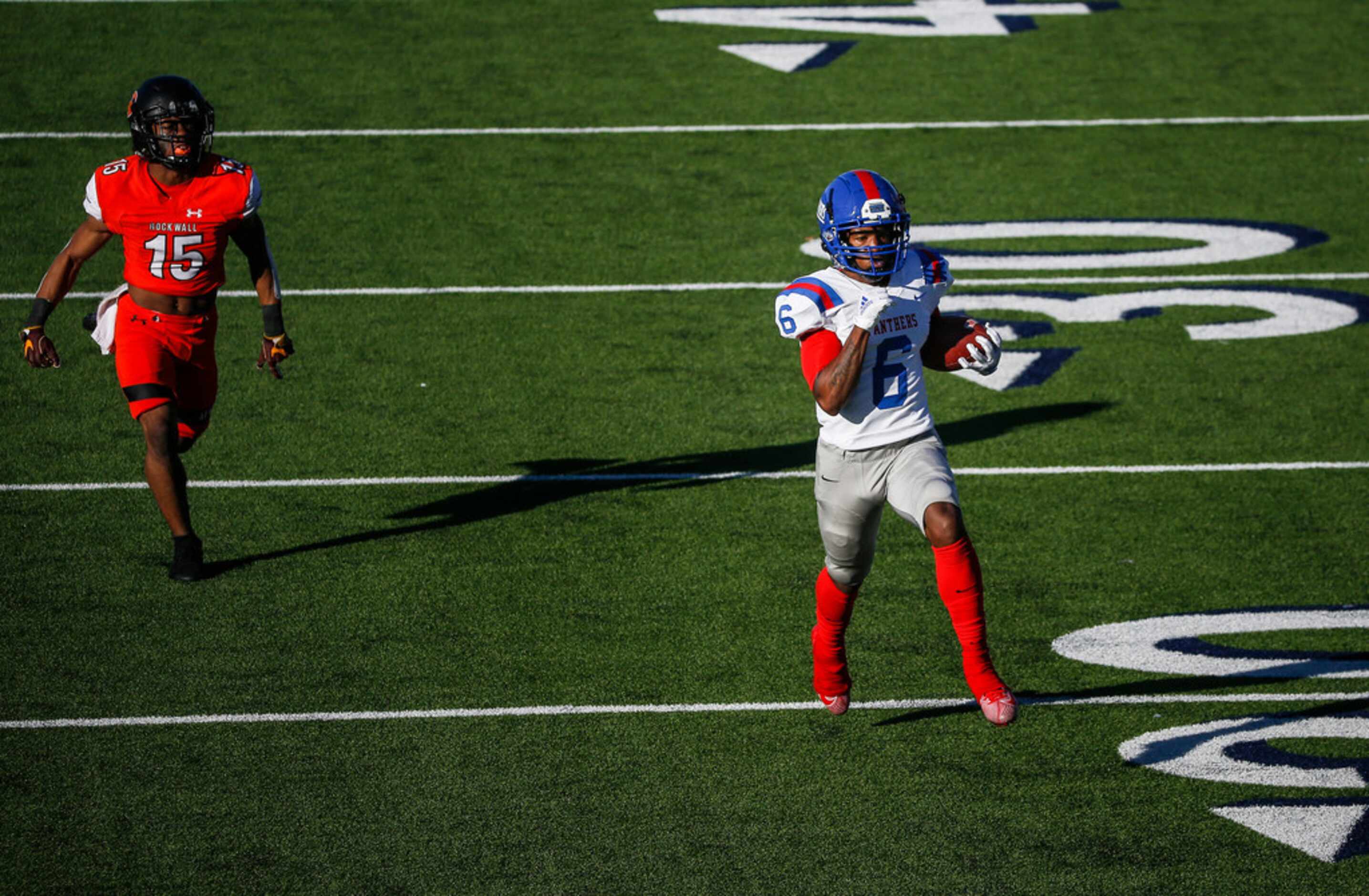 Duncanville wide receiver Marquelan Crowell (6) runs in a touchdown past Rockwall defensive...