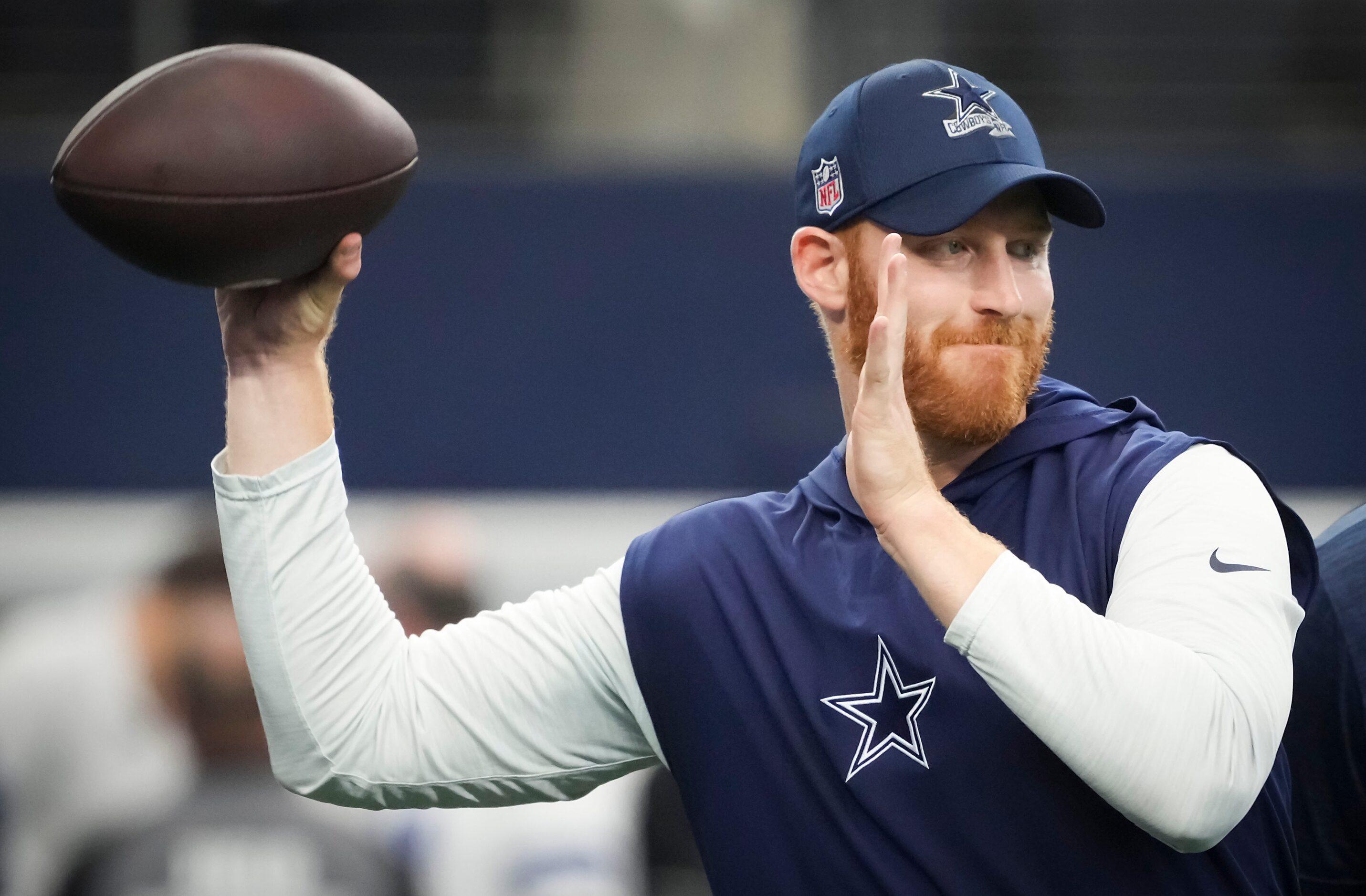 Dallas Cowboys quarterback Cooper Rush warms up before an NFL football game against the...