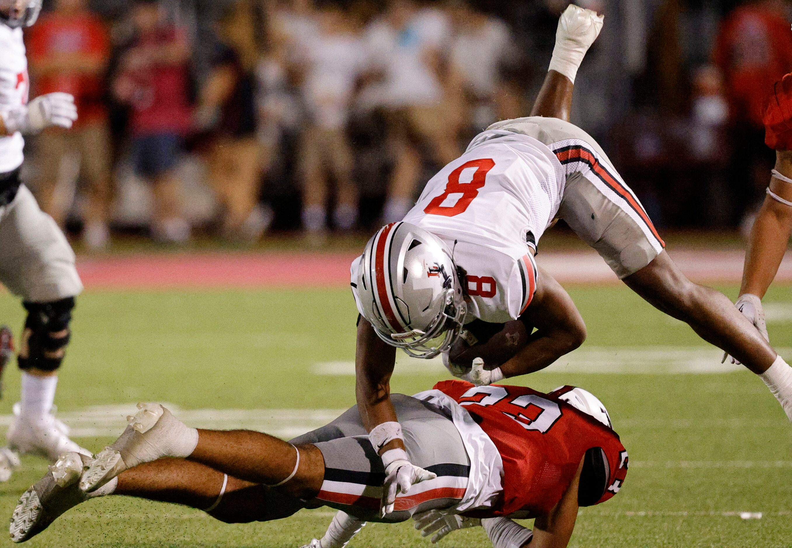 Lovejoy's Khalin Williams (8) jumps over Argyle's Xavier Sanchez (23) during the second half...