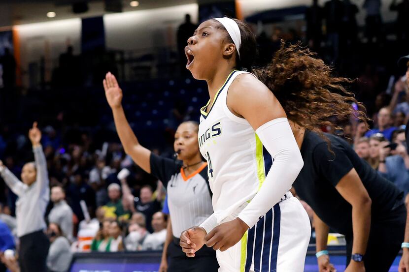 Dallas Wings guard Arike Ogunbowale, front right, reacts after her last-second shot did not...