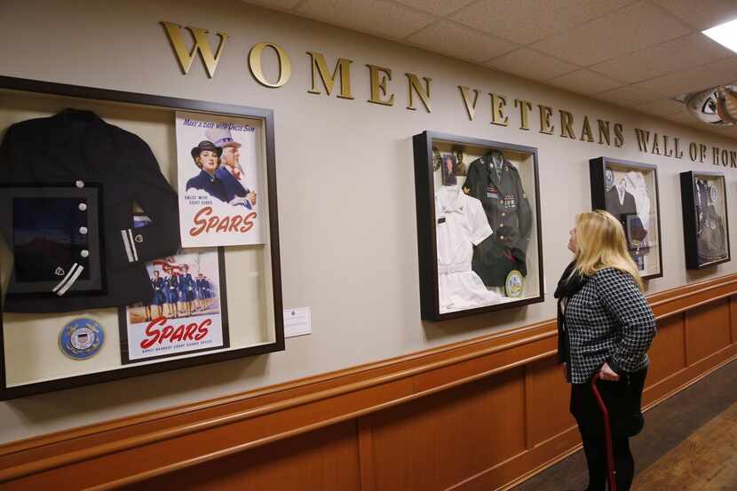 
Eva Fulton looks at the uniforms on display at the medical center. The Army veteran says...