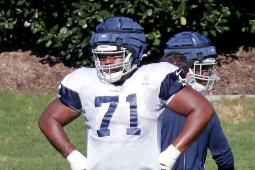 Tackle Chuma Edoga (71) waits for the next drill as the Dallas Cowboys held practice at The...