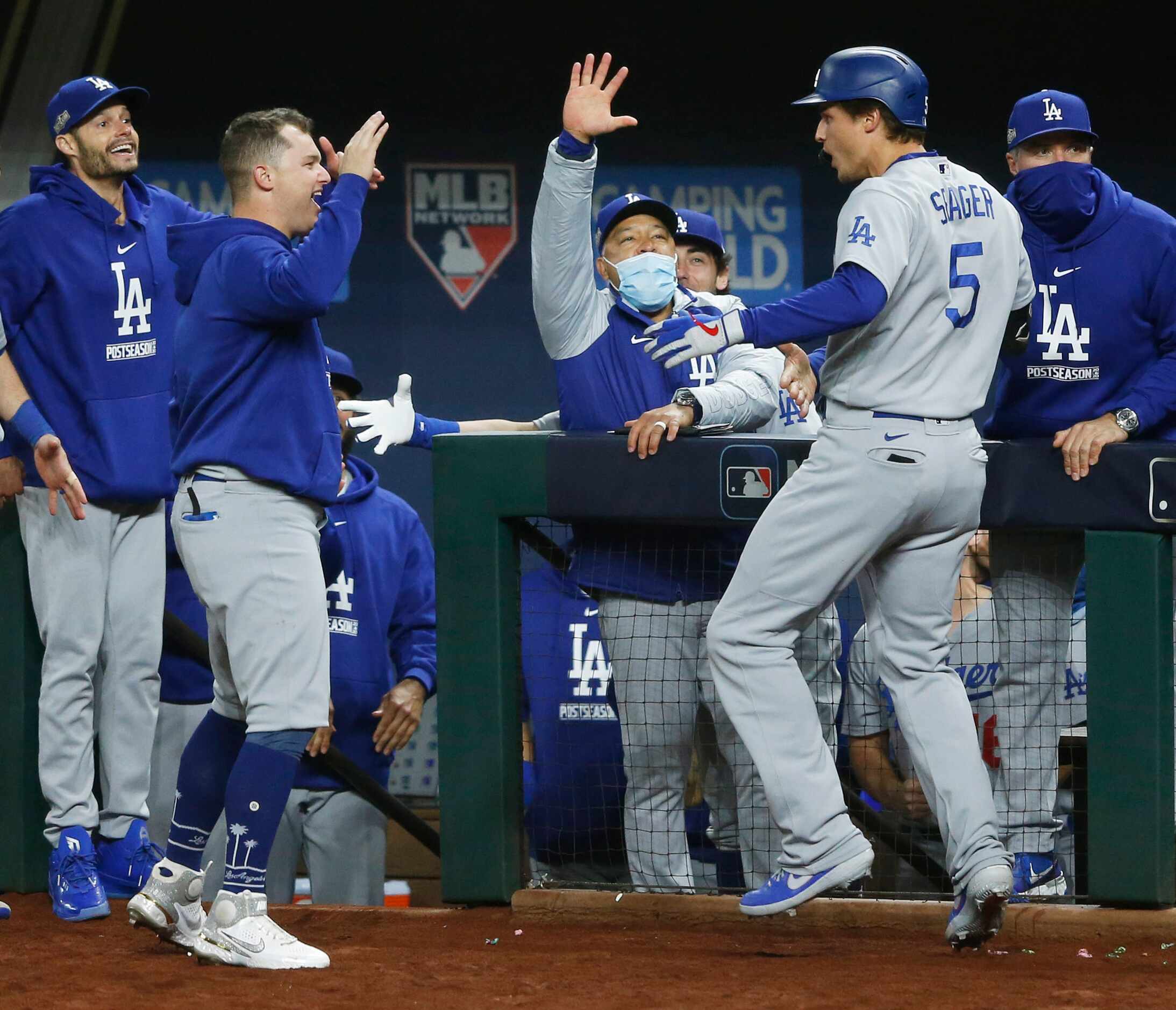 Los Angeles Dodgers shortstop Corey Seager (5) celebrates with teammates after hitting a two...