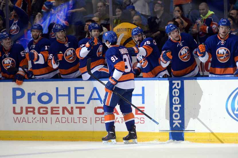 Jan 6, 2014; Uniondale, NY, USA; New York Islanders center John Tavares (91) celebrates a...
