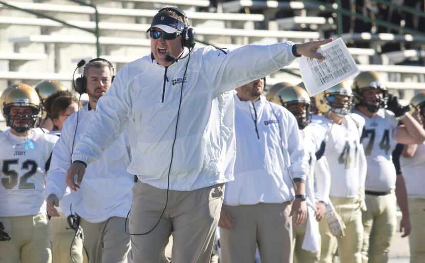 Dallas Jesuit head coach Brandon Hickman attempts to argue a call with a game official...