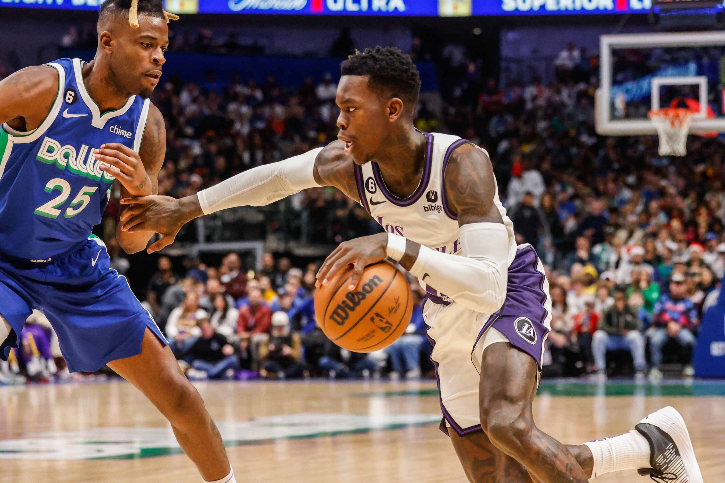 Los Angeles Lakers guard Dennis Schroder (17) tries to go around Dallas Mavericks forward...