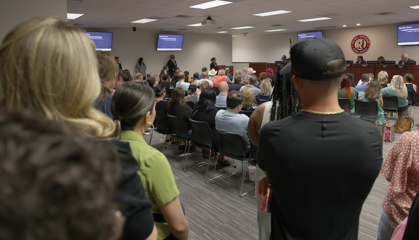 An overflow crowd listens to a speaker during a Rockwall ISD School Board special session on...