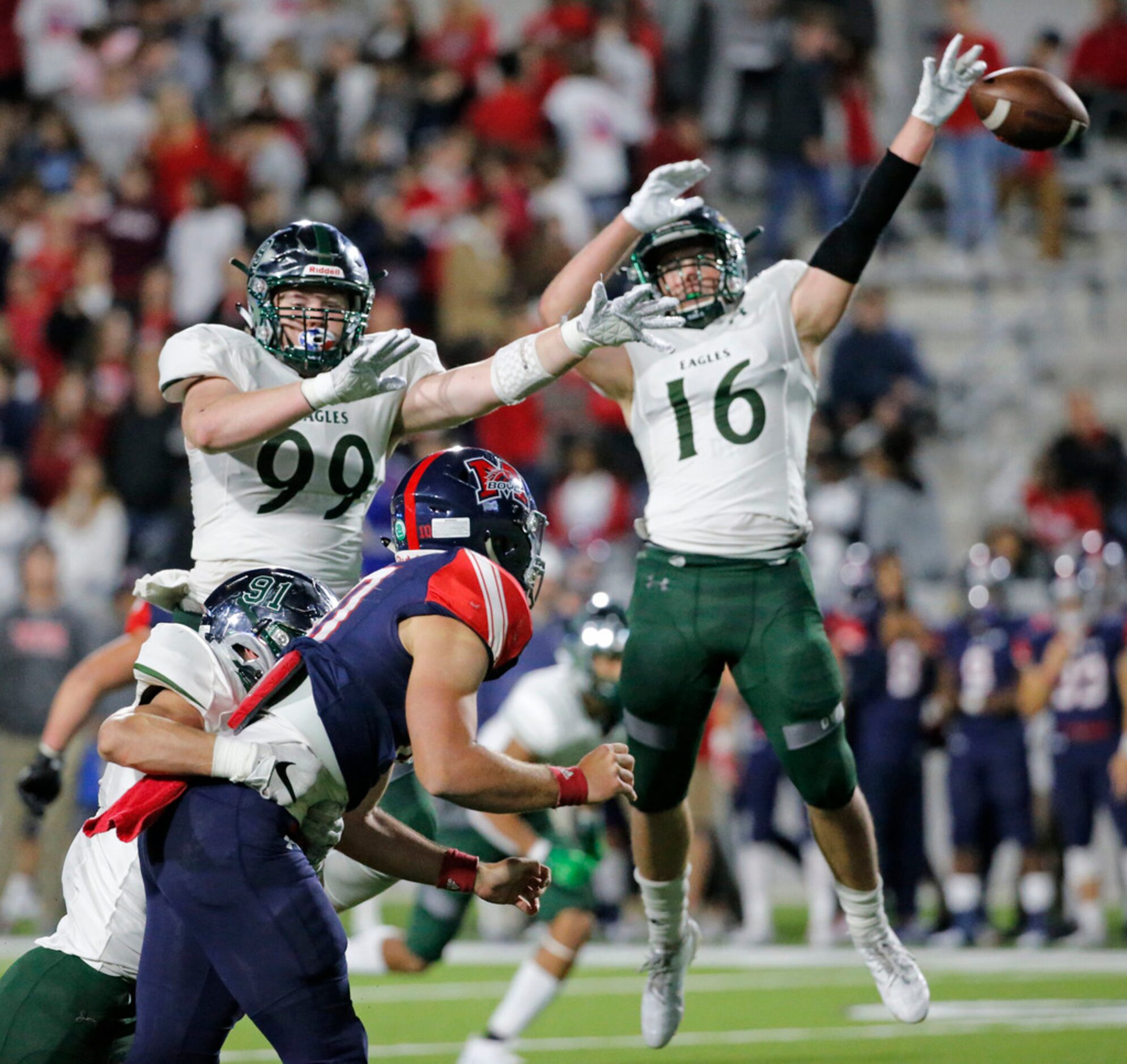 Prosper defenders Jack Peterson (91), Will Prendergast (99) and Cabe Parham (16) pressure...