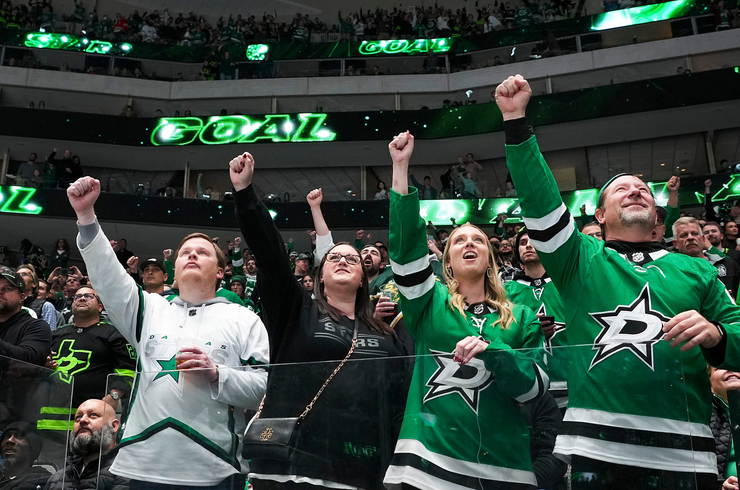 Dallas Stars fans cheer a goal by left wing Jason Robertson during the first period of an...