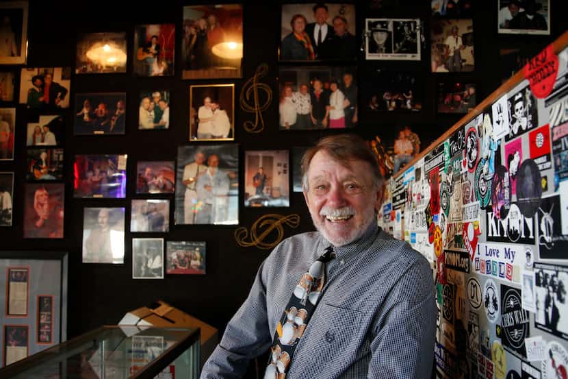 David Card with a few of the pictures of musicians and memorabilia at Poor David's Pub in...