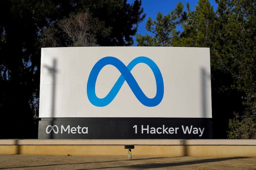 FILE - Meta's logo is seen on a sign, Nov. 9, 2022, at the company's headquarters in Menlo...