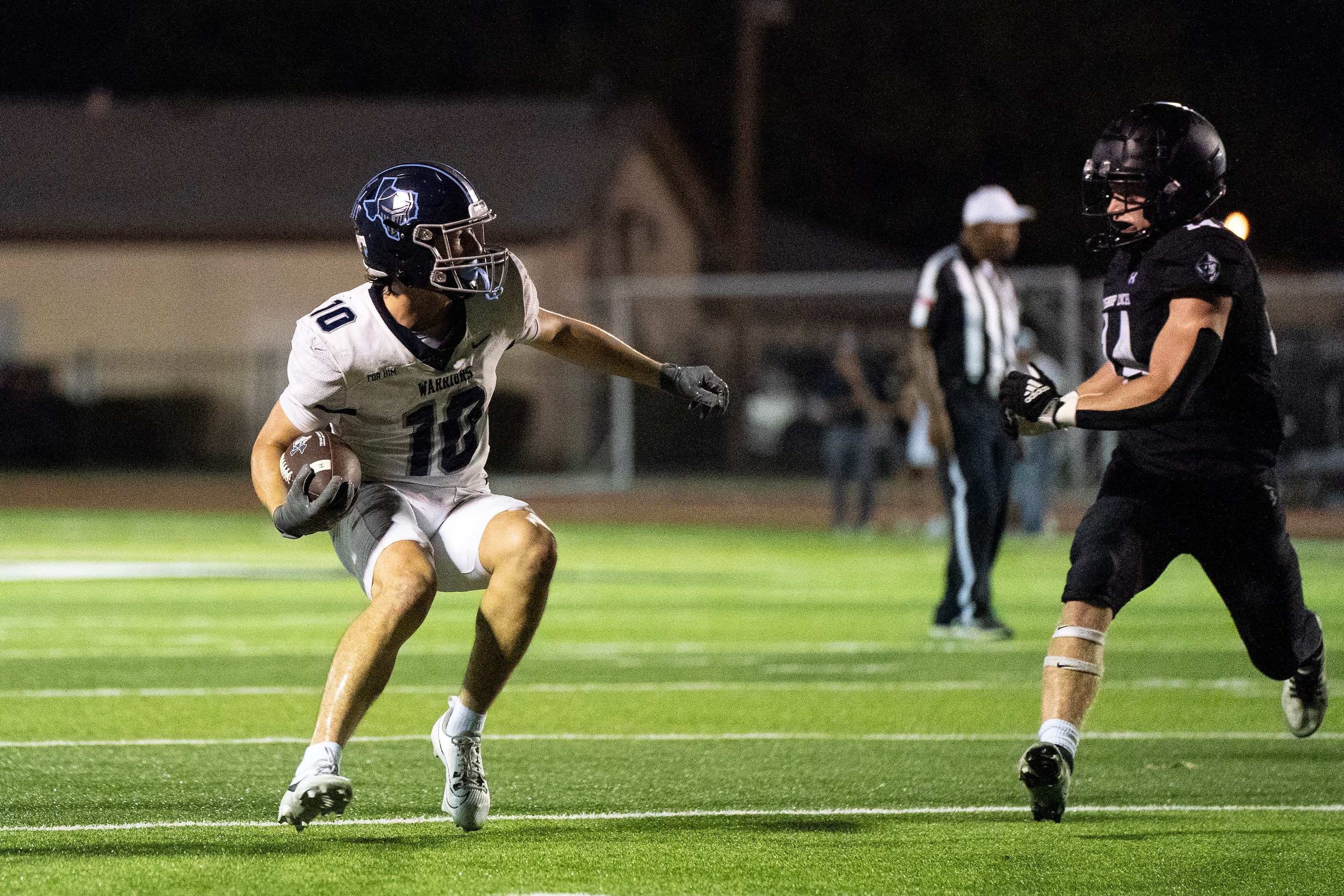 Argyle Liberty Christian junior wide receiver Brady Janusek tries to evade Bishop Lynch...