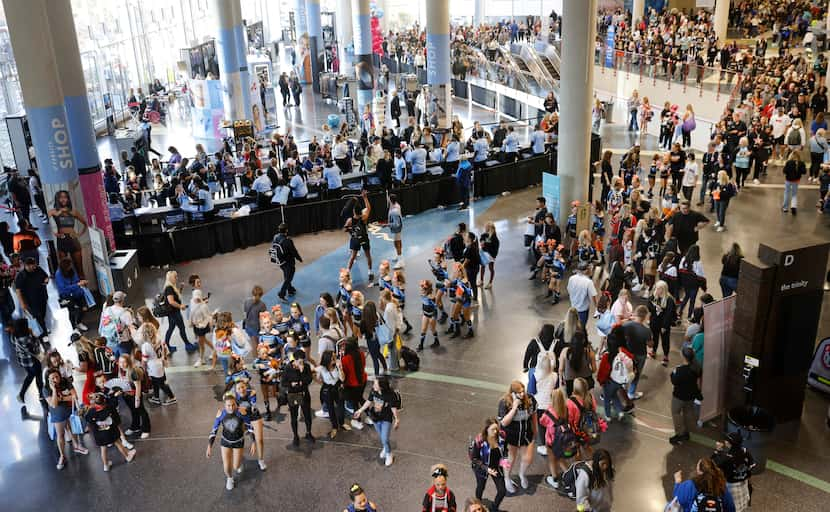 Cheer teams make their way to competition as others mingle and shop at the Varsity Shop...