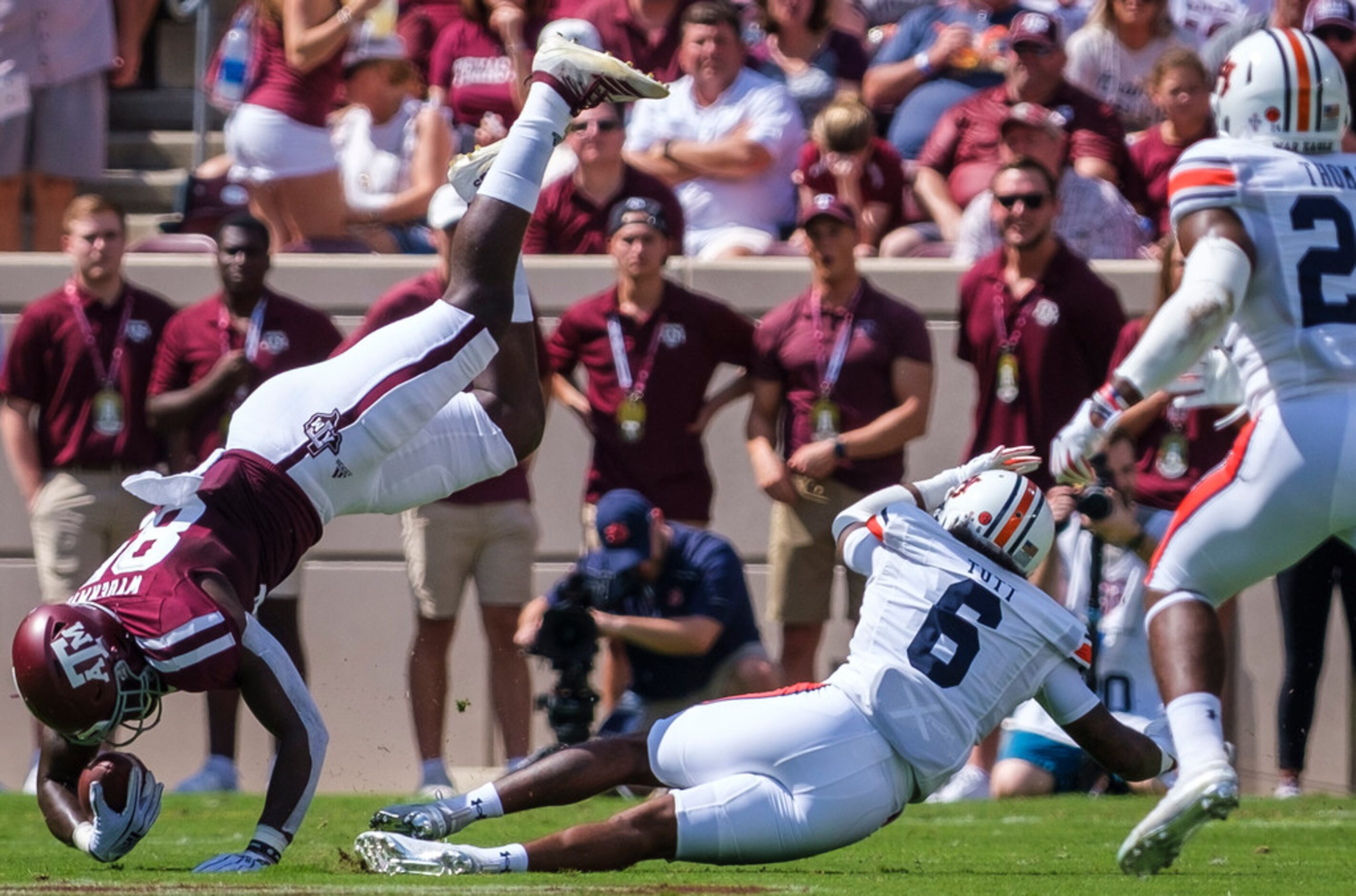 Texas A&M tight end Jalen Wydermyer (85) is upended by Auburn defensive back Christian Tutt...