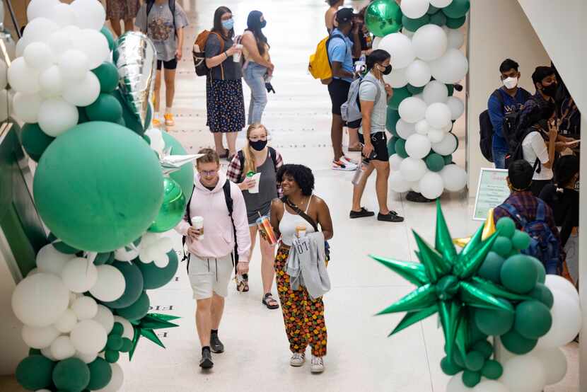 Students walk through the university union during the first day of class on Monday, Aug. 23,...