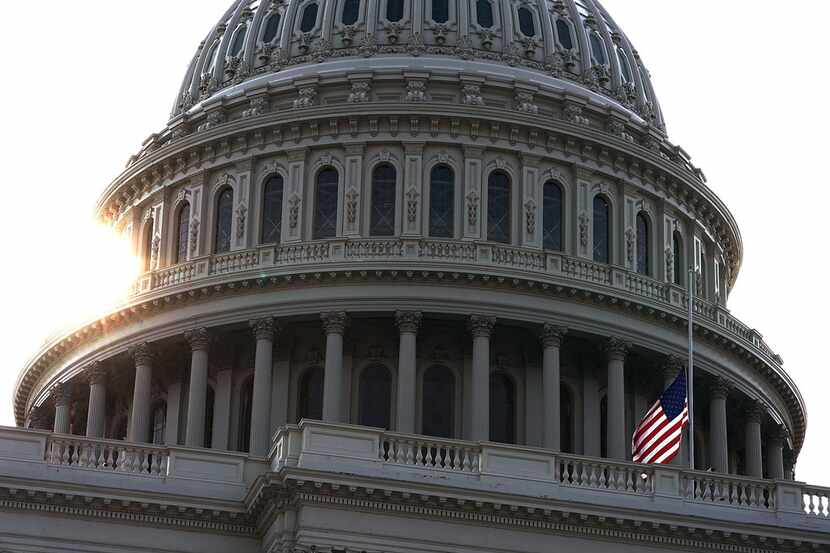 The American flag at the U.S. Capitol flies at half staff Aug. 27, 2018. Sen. John McCain,...