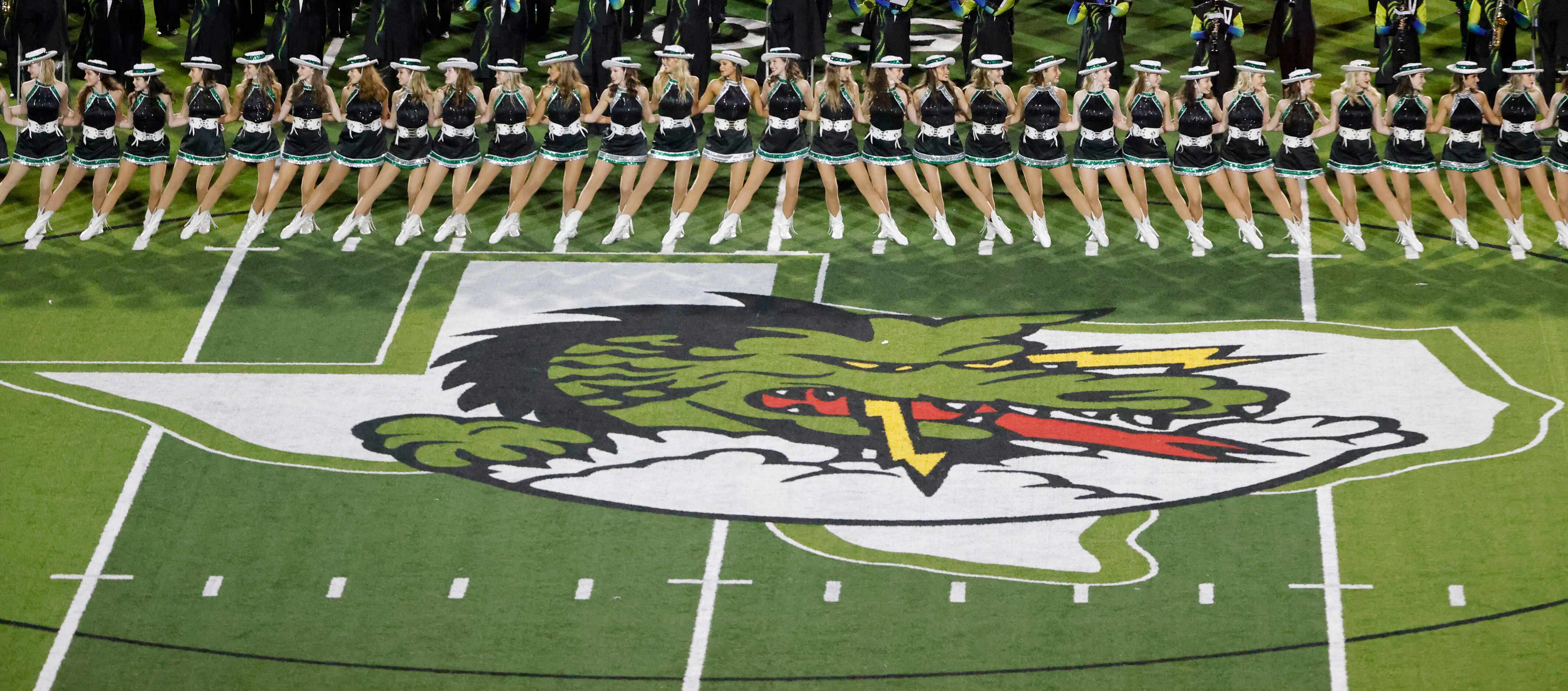 The Southlake Emerald Belles drill team performs during halftime of  a high school football...