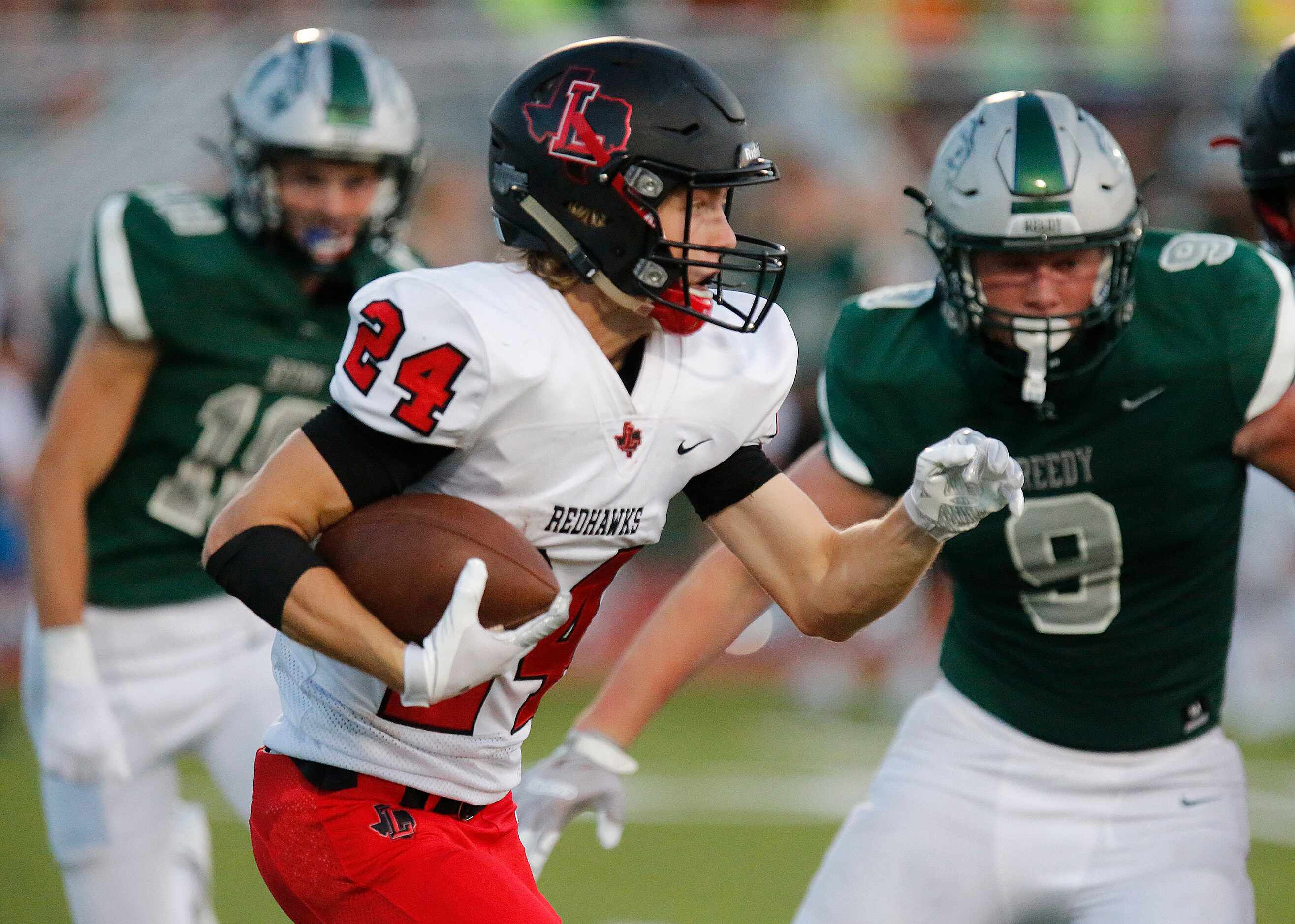 Liberty High School wide receiver Jack Bryan (24) runs after the catch during the first half...