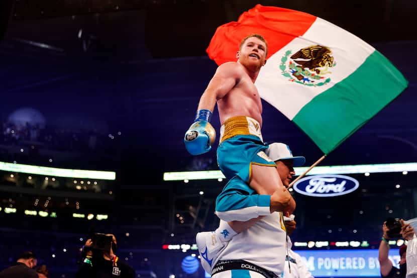 Boxer Canelo Alvarez celebrates after defeating Billy Joe Saunders in the eighth round of...