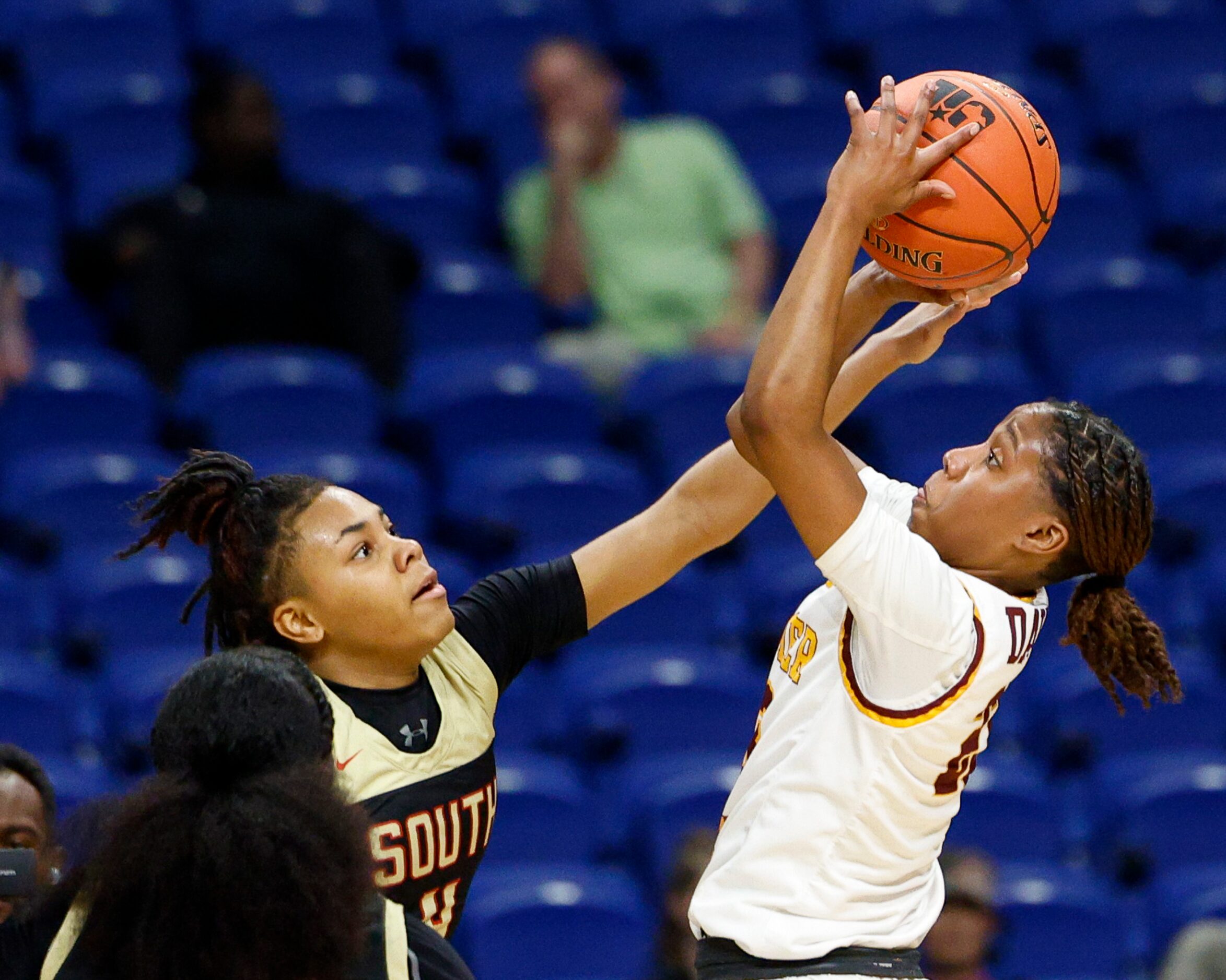 South Grand Prairie guard Joy Madison-Key (4) contests a shot from Humble Summer Creek guard...