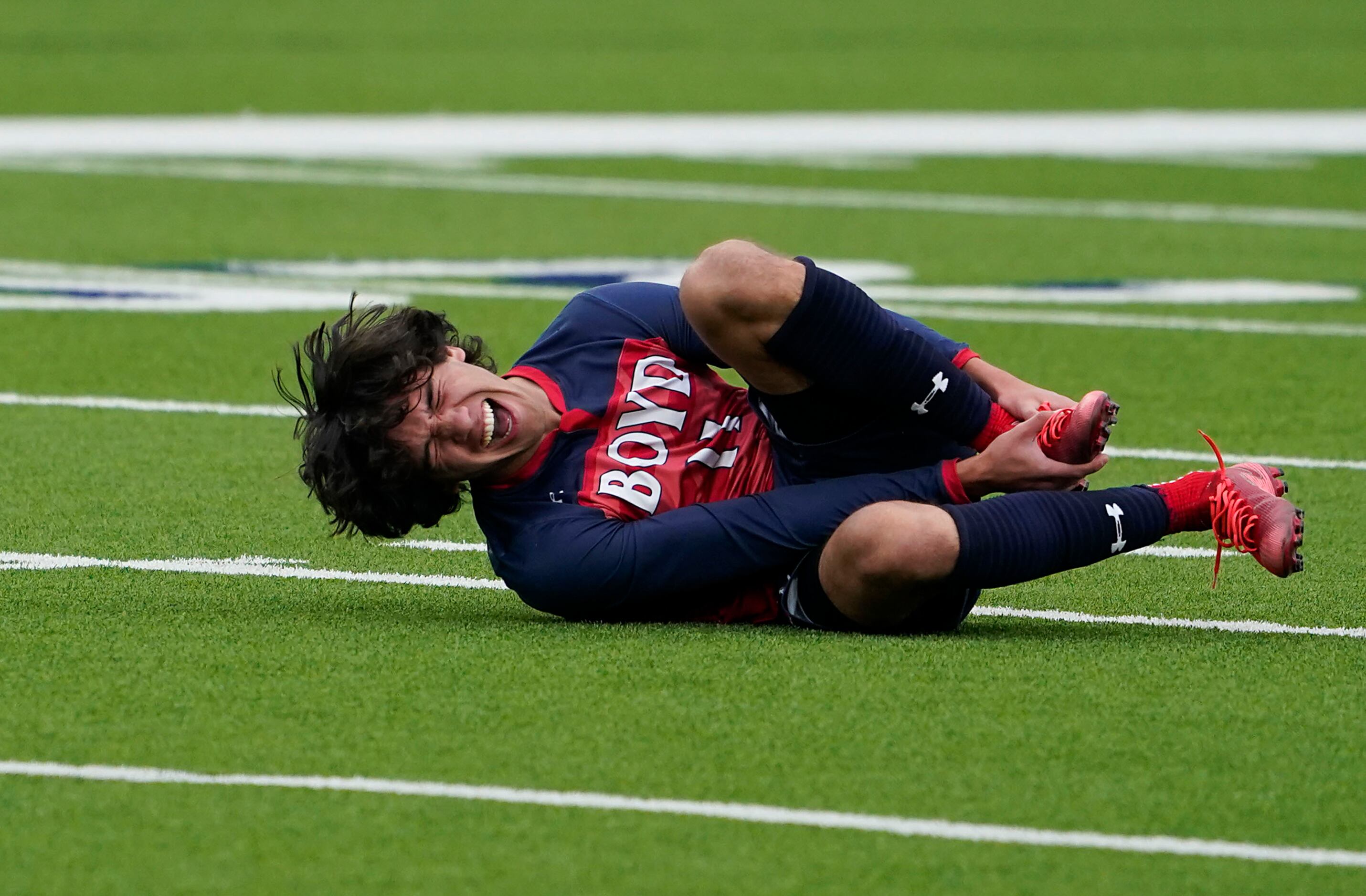 McKinney Boyd forward Jonathan Marquez grabs his foot after being fouled during a Class 6A...