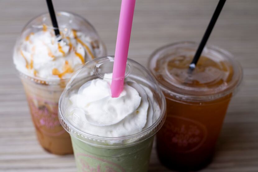 Iced caramel macchiato, left, matcha frappe and guava teamanade photographed at Pink Coffee...