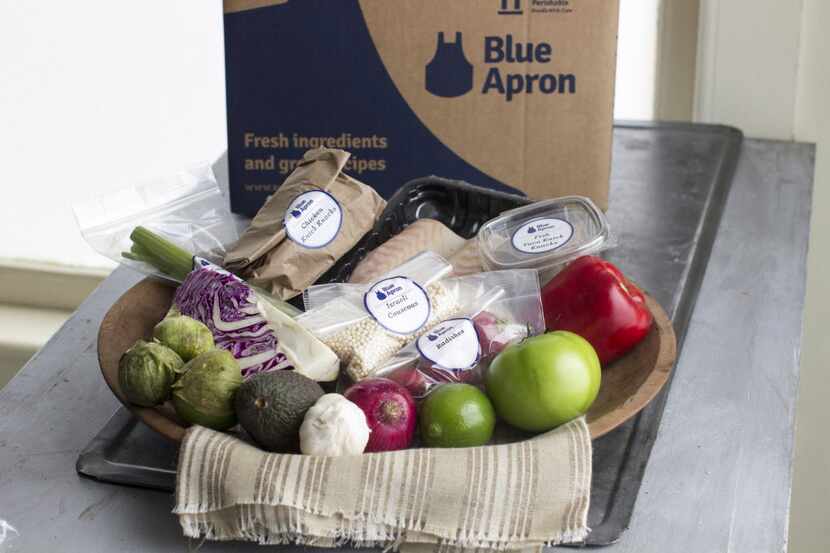 This Oct. 6, 2014 photo shows an example of a home delivered meal from Blue Apron, in...