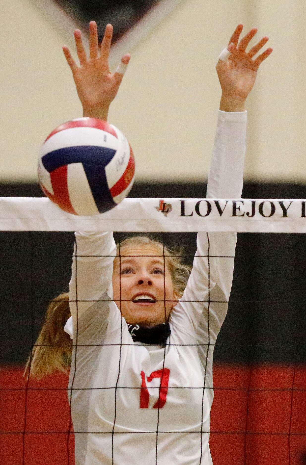 Lovejoy High School right side Rosemary Archer (17) gets a block during game one as Lovejoy...