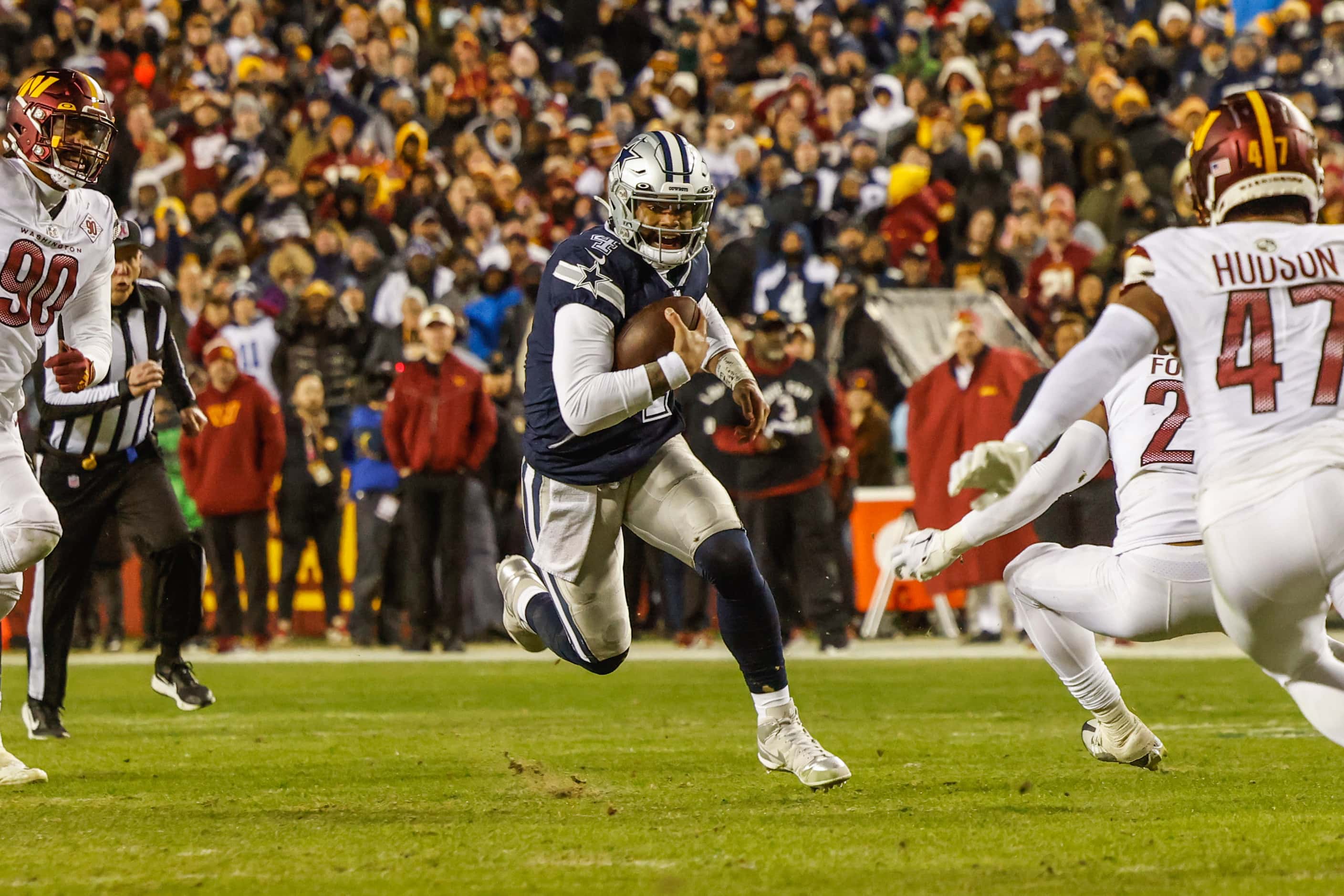 Dallas Cowboys quarterback Dak Prescott (4) runs with the football against Washington...