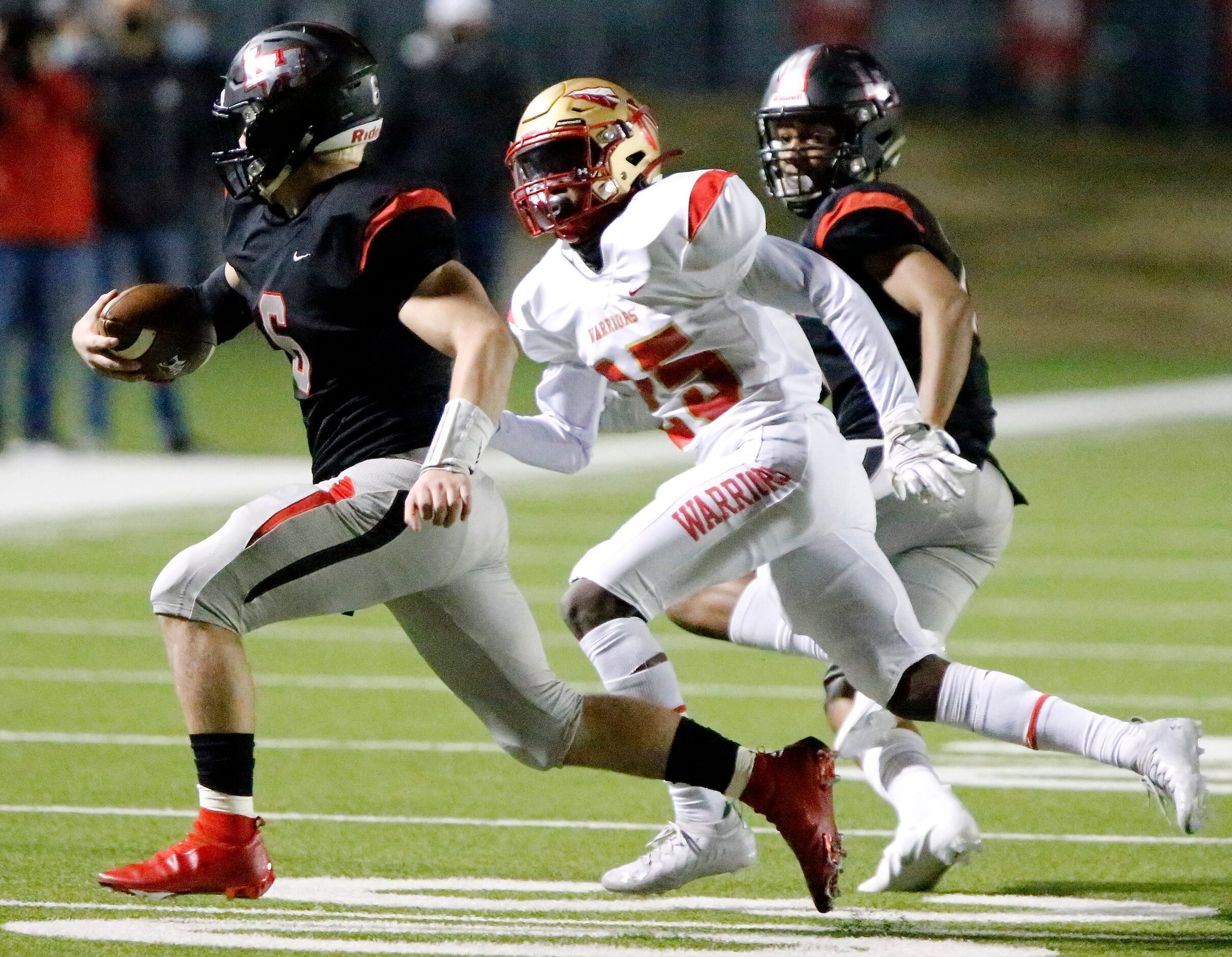 Lake Highlands High School quarterback Mitch Coulson (6) is tackled by South Grand Prairie...