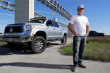 Brian Whittington, with his Toyota Tundra pick-up he uses to tow a single axle trailer for...
