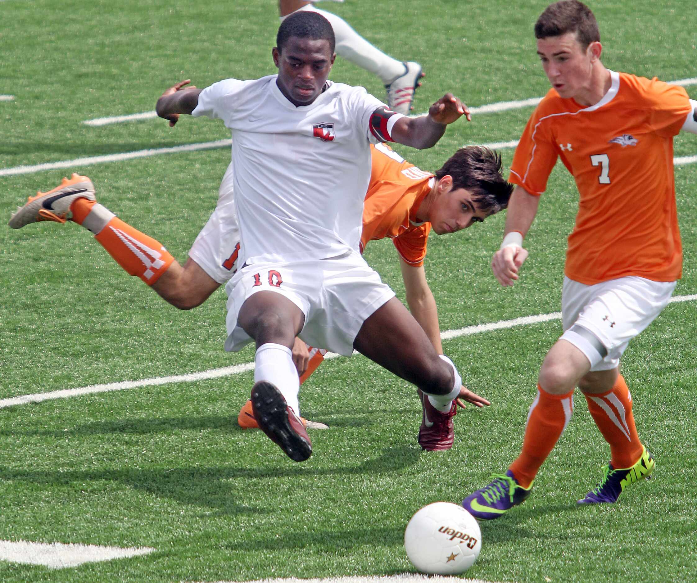 Frisco Liberty's Christian Mayho (19, left) and Frisco Wakeland's Corey Cantor (7) fight for...