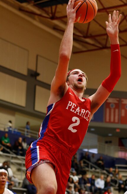 Richardson JJ Pearce post Drew Timme (2) goes strong to the basket to finish a fast break...