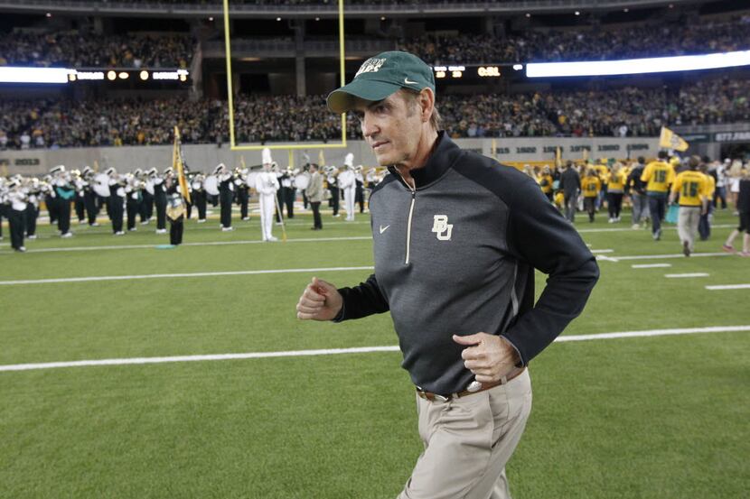Baylor Bears head coach Art Briles walk onto the field prior to playing the Kansas State...
