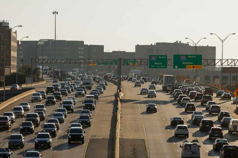 Vehicles travel along Woodall Rogers Freeway also known as Spur 366 in Dallas, Tuesday, Nov....