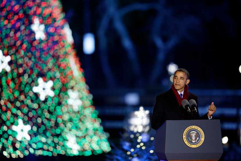 President Barack Obama speaks during the 90th annual National Christmas Tree Lighting...