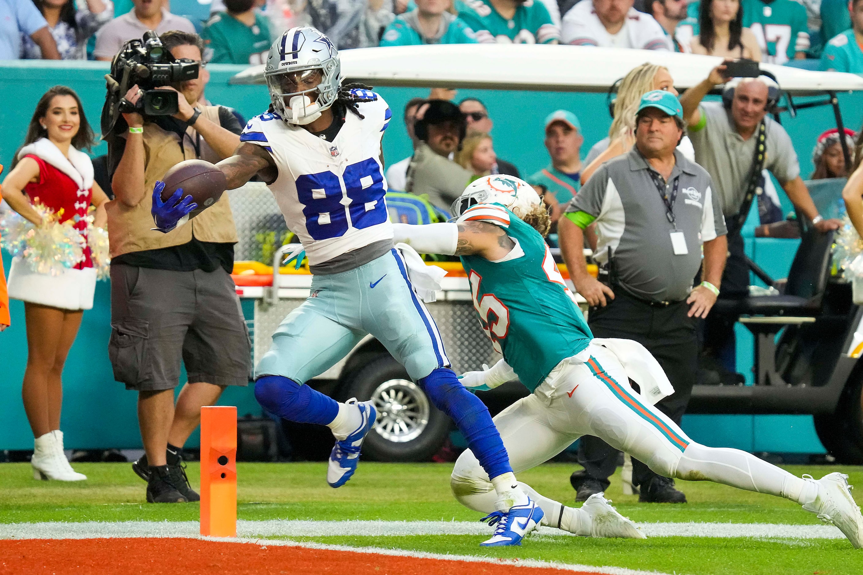 Dallas Cowboys wide receiver CeeDee Lamb (88) scores past Miami Dolphins linebacker Duke...