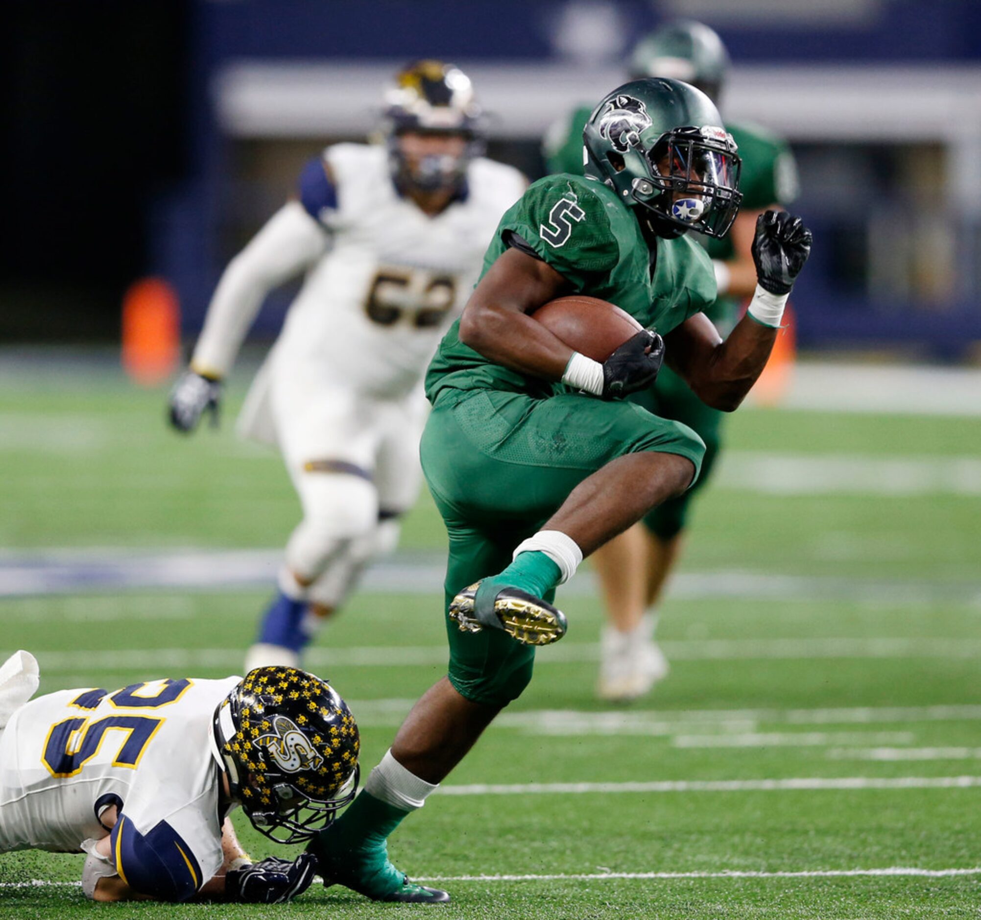 Kennedale's Jaden Knowles (5) breaks away from Stephenville's Gage Graham (25) on his way to...