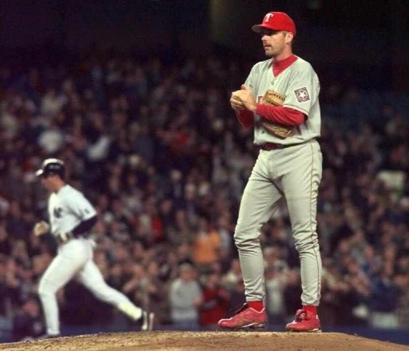 ORG XMIT: S11668239_WIRE Texas Rangers pitcher John Burkett stands on the mound as New York...