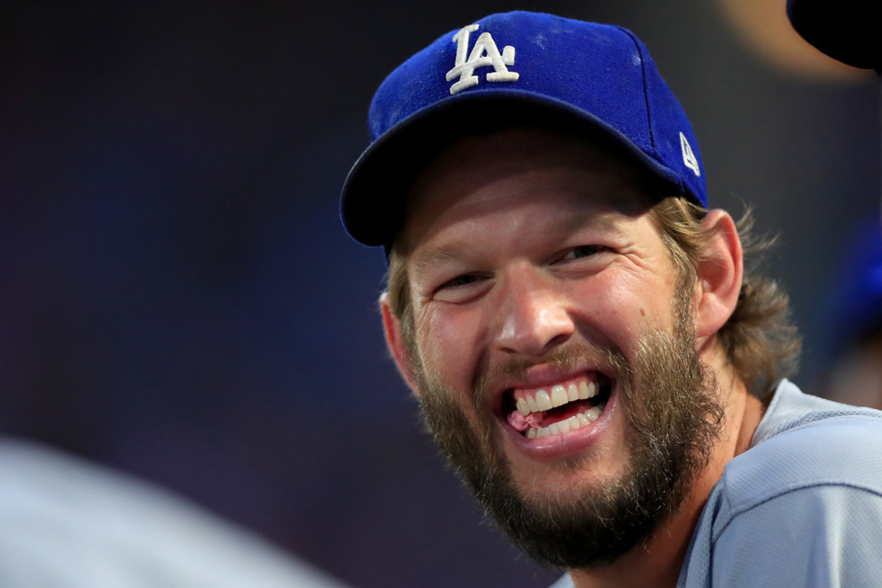 ARLINGTON, TX - AUGUST 28:  Clayton Kershaw #22 of the Los Angeles Dodgers looks on from the...