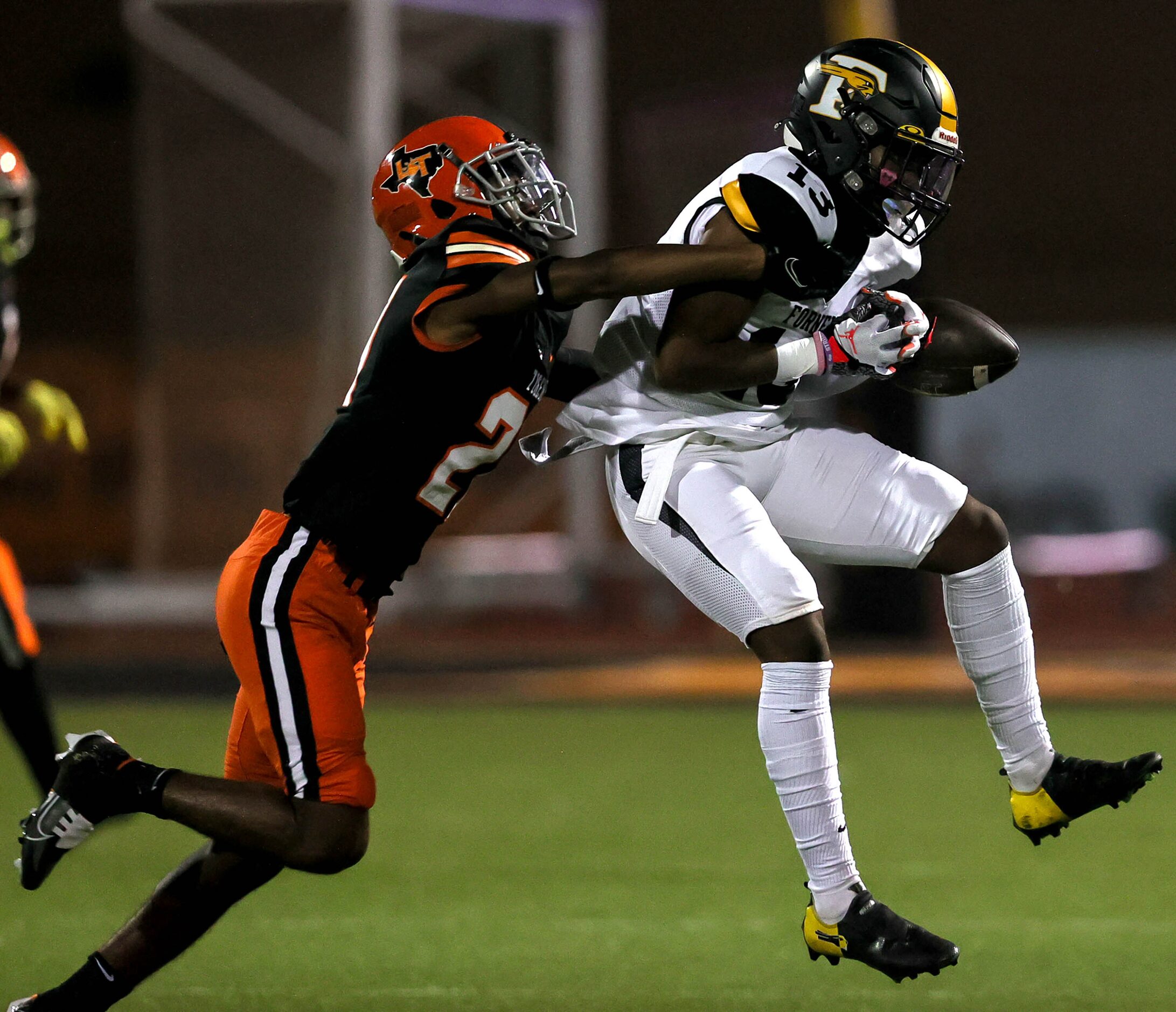 Forney wide receiver Ashton Ford (13) can't come up with a reception against Lancaster...