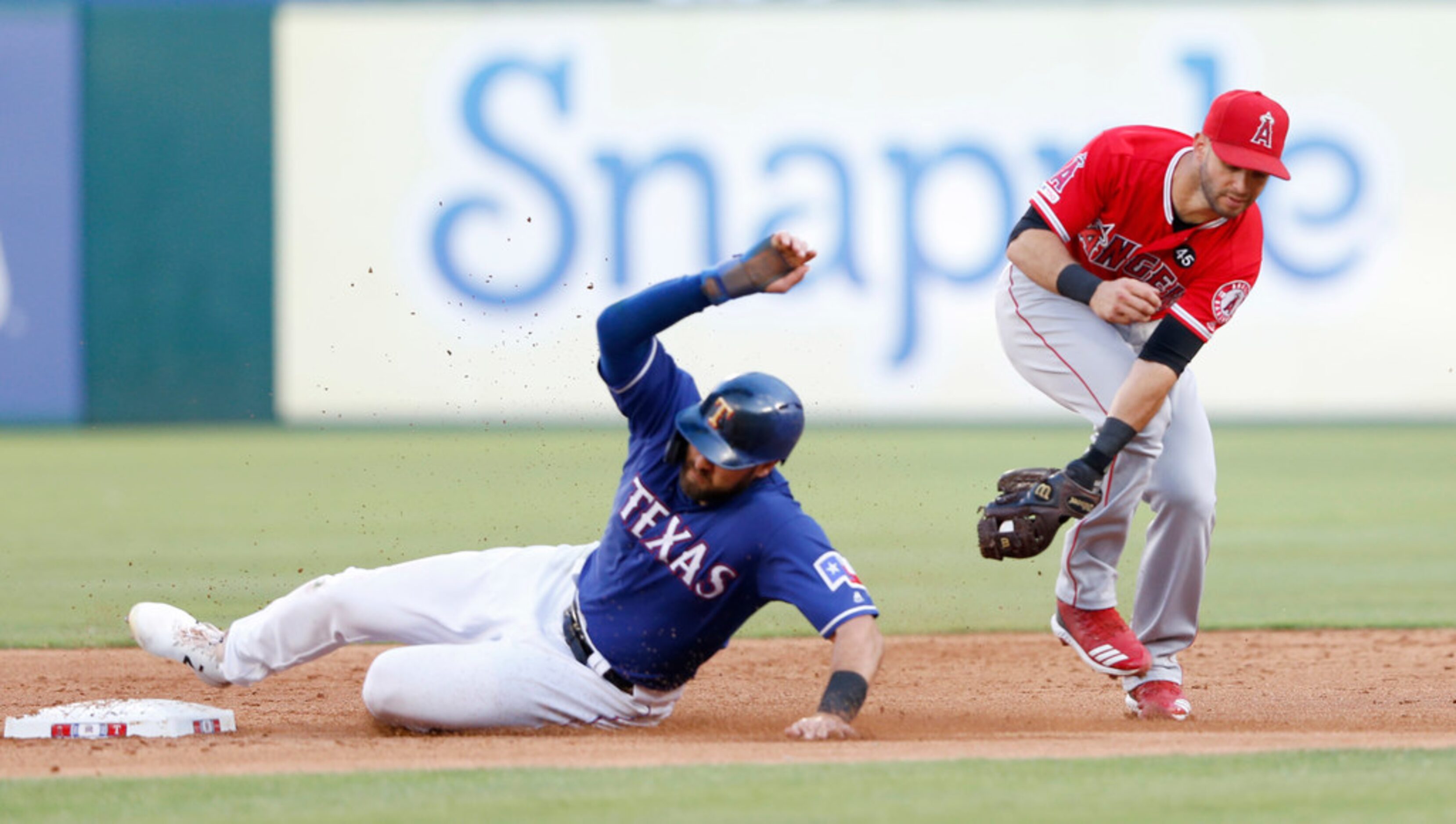 Texas Rangers left fielder Joey Gallo (13) safely steals second base as Los Angeles Angels...