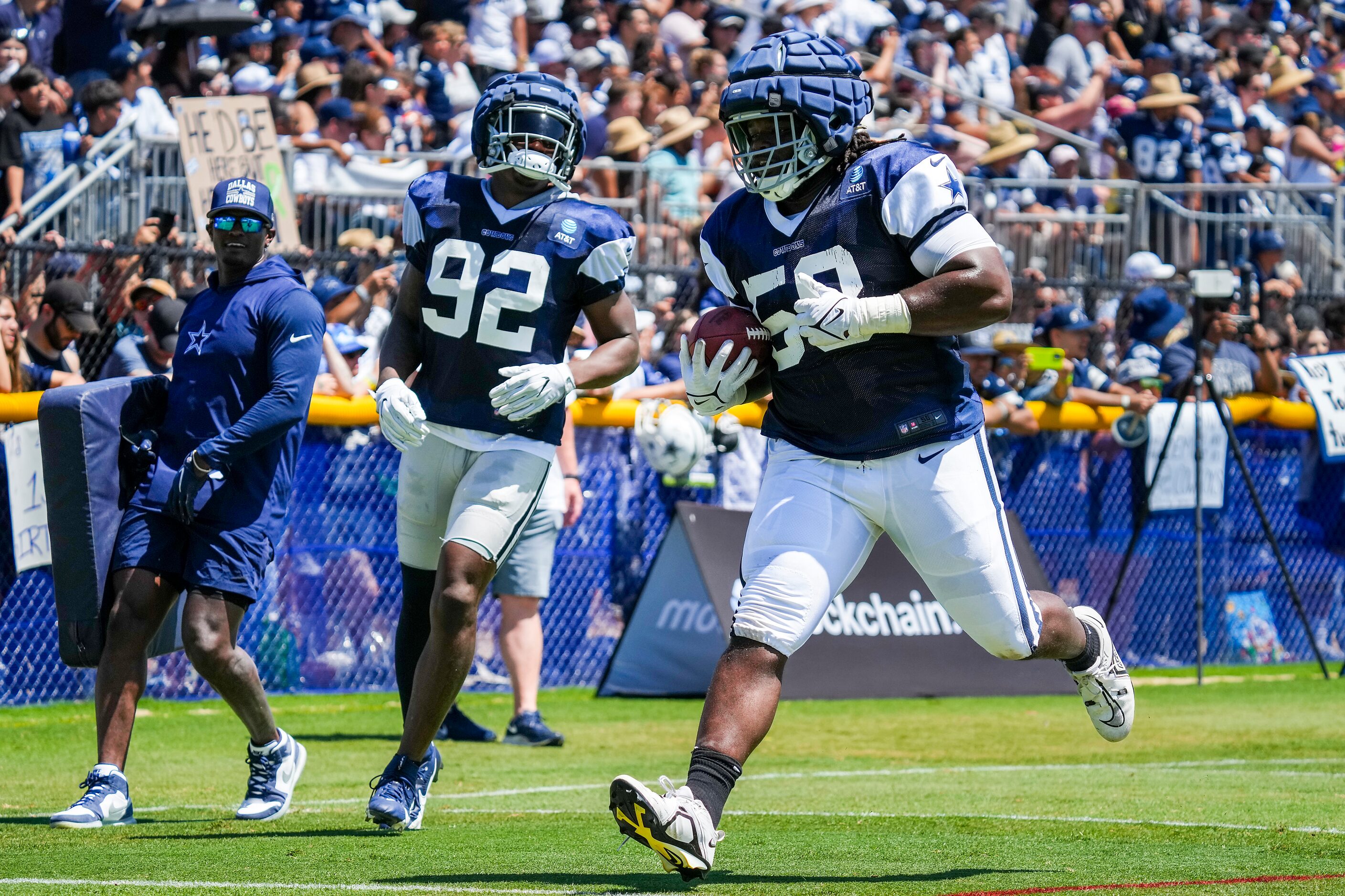 Dallas Cowboys defensive tackle Mazi Smith (58) returns a fumble recovering in a drill with...