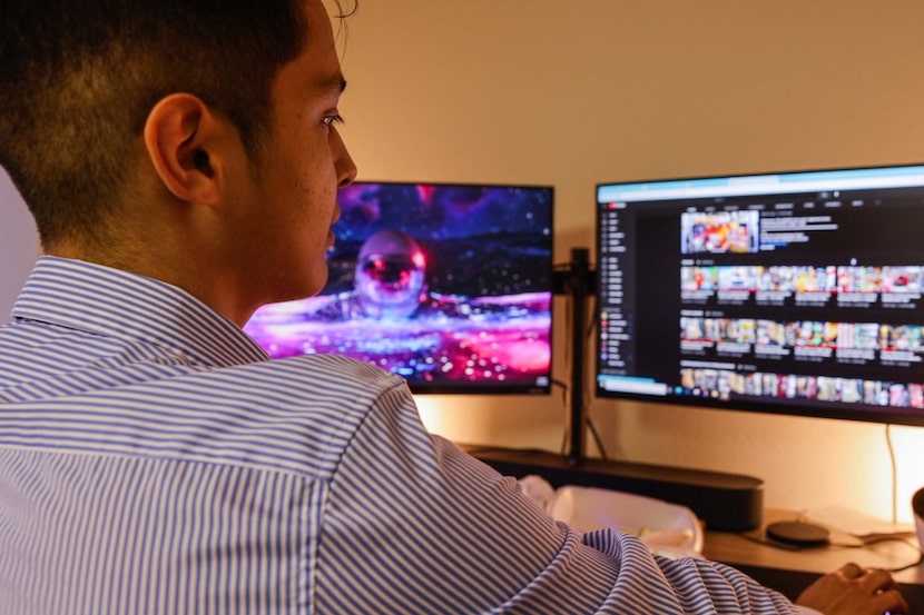 Jaime Ibanez, 21, checks his YouTube page at his company's warehouse in Haltom City.