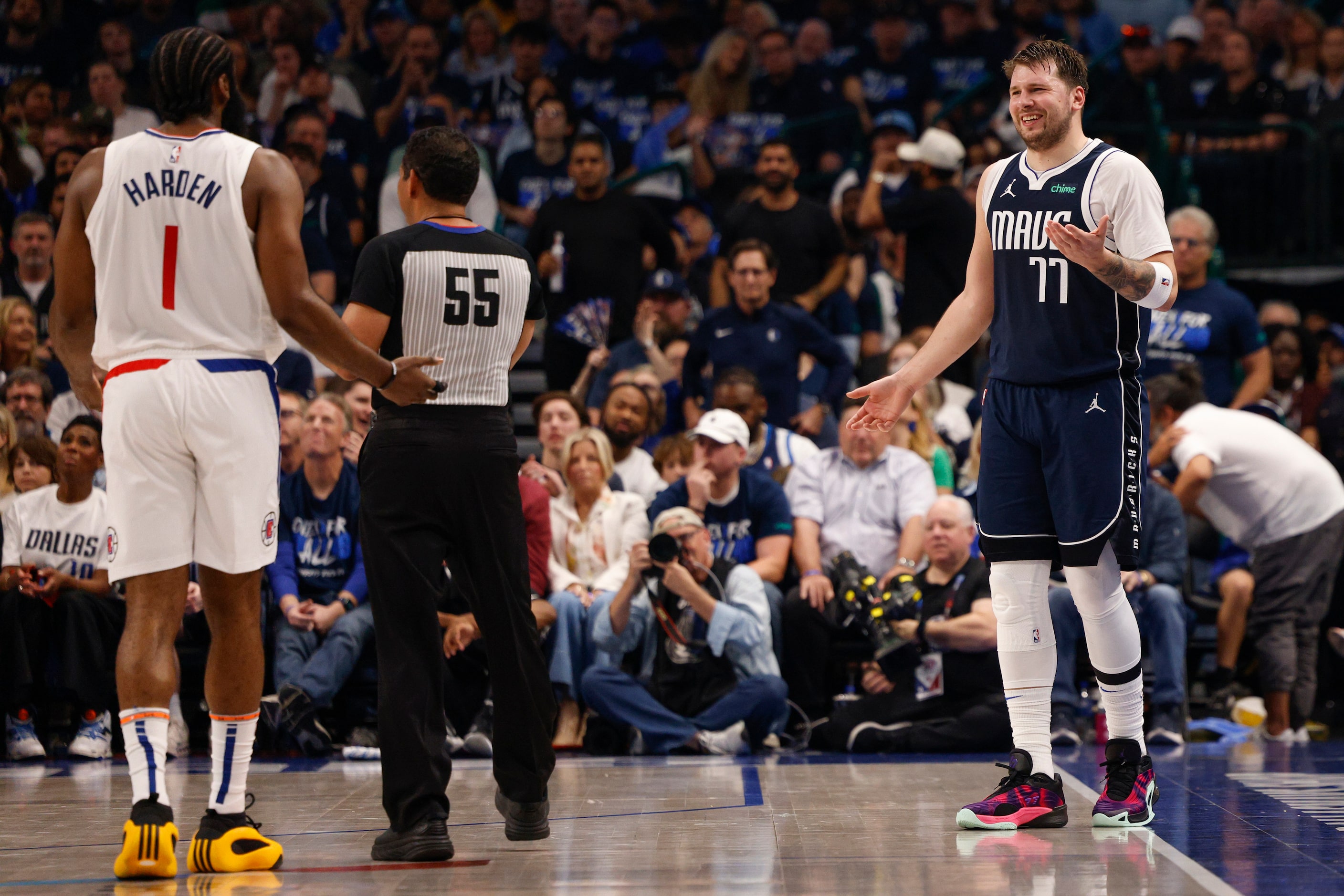 Dallas Mavericks guard Luka Doncic (77) talks with LA Clippers guard James Harden (1) after...